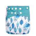 A reusable cloth diaper with a white base printed with blue owl and leaf patterns, featuring a solid teal blue waistband with white snap closures.
